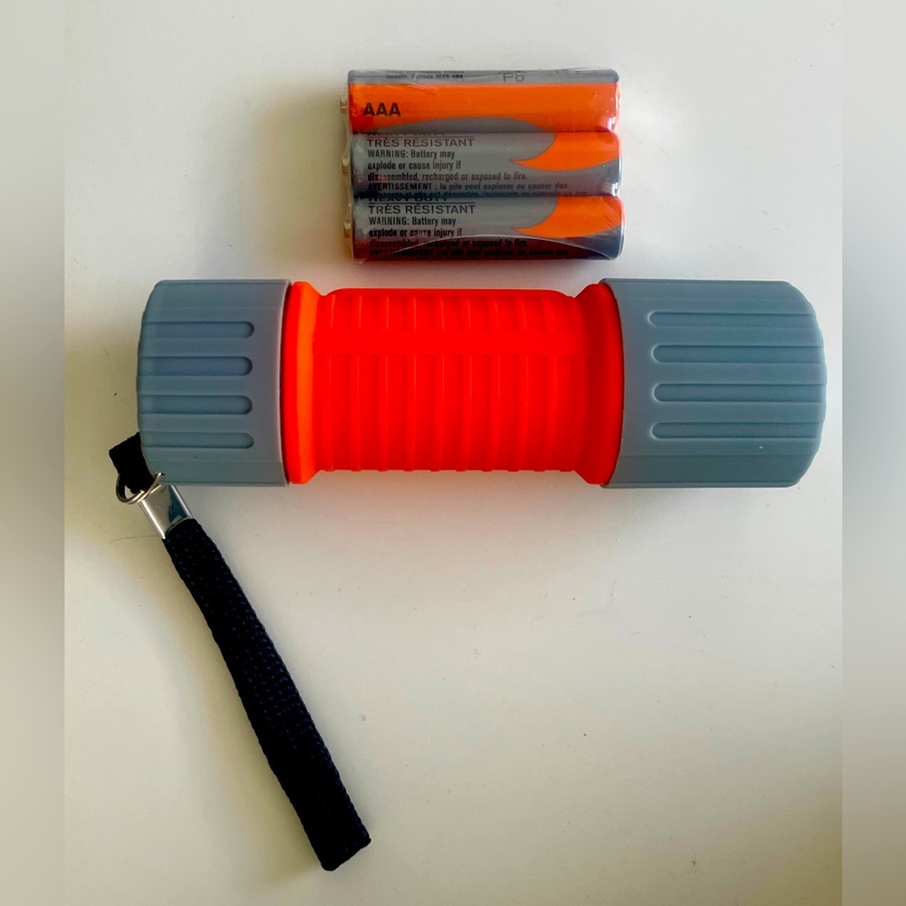 Orange and Gray Flashlight with Batteries, 30 Lumens LED. 3 AAA Batteries inc.